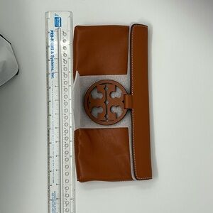 Brand new, Tory Burch clutch. Never used.
